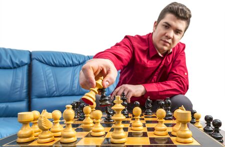 Close up of the hands of a man playing chess. Selective focus on the hand.の写真素材