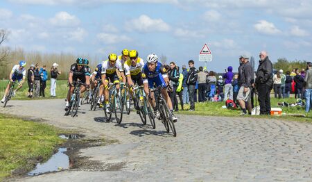 Hornaing ,France - April 10,2016: The German cyclist Tony Martin of Etixx-Quick Step Team riding in the peloton on a paved road in Hornaing, France during Paris Roubaix on 10 April 2016.のeditorial素材