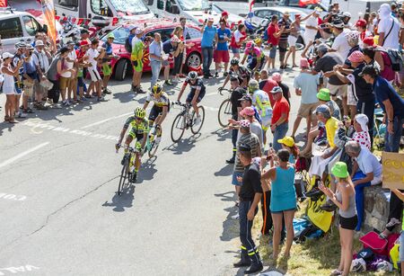 Col du Glandon, France - July 23, 2015: Alberto Contador of 	Tinkoff-Saxo Team riding in front of a group of cyclists in a beautiful curve at Col du Glandon in Alps during the stage 18 of Le Tour de France 2015.のeditorial素材