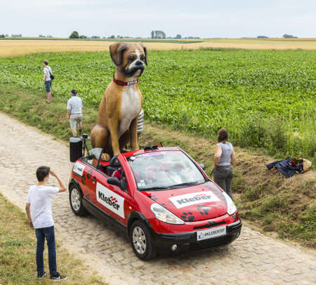 Quievy,France - July 07, 2015: Kleber vehicle during the passing of the Publicity Caravan on a cobblestoned road in the stage 4 of Le Tour de France on July 7 2015 in Quievy, France. Kleber is a famous European company which products a wide range of tiresのeditorial素材