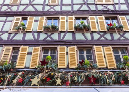 Colmar,France - December 6,2013: Detail of a traditional winter olidays decoration on a half-timbered house in Colmar,Alsace,France on December 6,2013.のeditorial素材