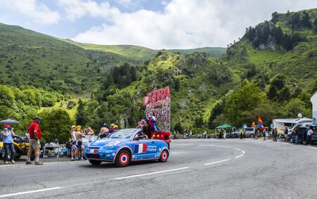 Col du Tourmalet, France - July 24,2014: X'tras caravan during the passing of the Publicity Caravan on the road to Col de Tourmalet in the stage 18 of Le Tour de France 2014.Before the appearance of the cyclists there is a caravan of advertising cars of tのeditorial素材