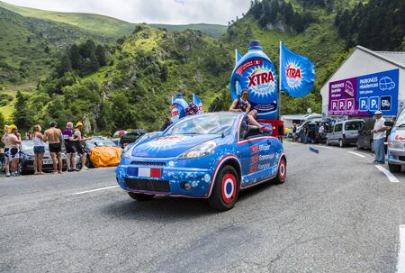 Col du Tourmalet, France - July 24,2014: X'tras caravan during the passing of the Publicity Caravan on the road to Col de Tourmalet in the stage 18 of Le Tour de France 2014.Before the appearance of the cyclists there is a caravan of advertising cars of tのeditorial素材