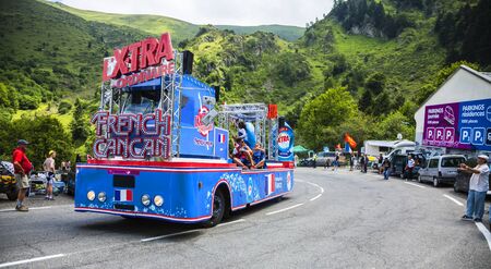 Col du Tourmalet, France - July 24,2014: X'tras caravan during the passing of the Publicity Caravan on the road to Col de Tourmalet in the stage 18 of Le Tour de France 2014.Before the appearance of the cyclists there is a caravan of advertising cars of tのeditorial素材