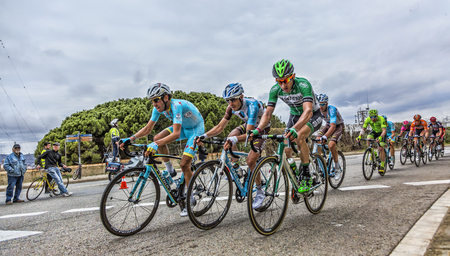 Barcelona, Spain - March27, 2016: Group of cyclists including Fabio Aru of Team Astana, riding on the road to the top of Montjuic in Bracelona Spain, during Volta Ciclista a Catalunya, on March 27, 2016.のeditorial素材