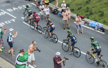 Col de Peyresourde,France- July 23, 2014: Five cyclists Yukiya Arashiro, Pierre Rolland (Europcar Team), Peter Velits (BMCTeam), Jon Izagirre Insausti, Giovanni Visconti (Movistar Team), climbing the road to Col de Peyresourde in Pyrenees Mountains duringのeditorial素材