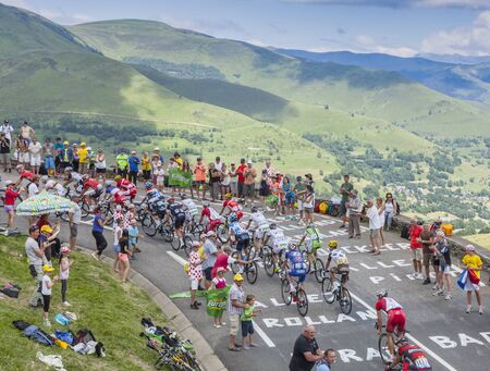 Col de Peyresourde,France- July 23, 2014: The peloton climbing the road to Col de Peyresourde in Pyrenees Mountains during the stage 17 of  Le Tour de France on 23 July 2014.のeditorial素材