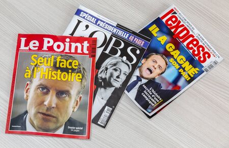 France - April 29,2017: Covers of various French magazines featuring the two presidential candidates which won the first round of the French elections 2017.のeditorial素材
