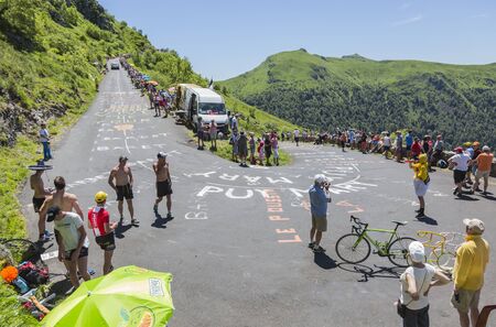 Pas de Peyrol, France - July 6,2016: Spectators and fans waiting for the cyclists on the road to Pas de Pyerol (Puy Mary) in Cantal, in the Central Massif, during the stage 5 of Tour de France on July 6, 2016 .のeditorial素材