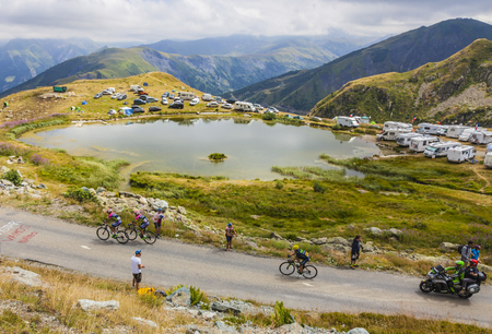 Col de la Croix de Fer, France - 23 July 2015: Three cyclists riding to the Col de la Croix de Fer in Alps during the stage 20 of Le Tour de France 2015.のeditorial素材