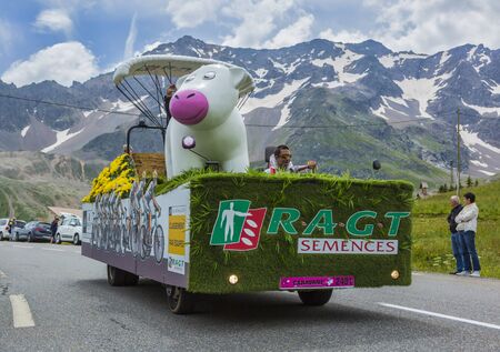 Col du Lautaret, France - July 19, 2014: The vehicle of RAGT Semences during the passing of the advertising caravan on mountain pass Lautaret during the stage 14 of Le Tour de France 2014. Before the appearance of the cyclists there is a caravan of advertのeditorial素材