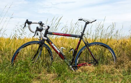 Quievy,France - July 07, 2015: Image of a MBK bicycle in a wheat field on the roadside, during the...