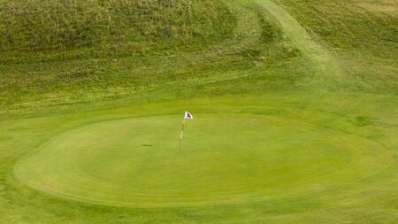 Detail of a green empty golf course in a rural area.の写真素材