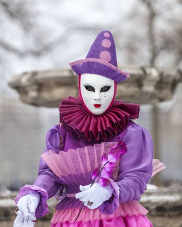 Annecy, France, February 23, 2013: Portrait of a disguised person posing in Annecy, France, during a Venetian Carnival which celebrates the beauty of the real Venice.のeditorial素材