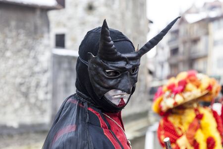 Annecy, France, February 23, 2013: Portrait of a disguised person posing in Annecy, France, during a Venetian Carnival which celebrates the beauty of the real Venice.のeditorial素材