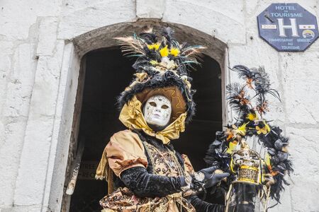 Annecy, France, February 23, 2013: Portrait of a disguised person posing in Annecy, France, during a Venetian Carnival which celebrates the beauty of the real Venice.のeditorial素材