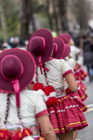 Paris, France - February 11,2018: Rear image of a row of Catalonian females  dancers performing in the street during the Carnaval de Paris 2018.のeditorial素材