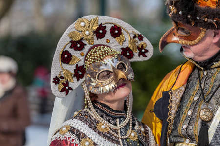 Annecy, France, February 24, 2013: A disguised couple posing in Annecy, France, during a Venetian Carnival which celebrates the beauty of the real Venice.のeditorial素材