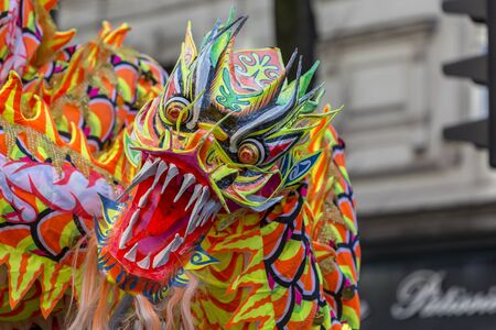 Paris,France-February 25,2018: Detail of the traditional Chinese Dragon performing in the street during the 2018 Chinese New Year parade in Paris.のeditorial素材