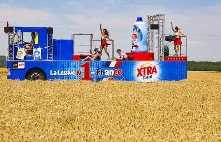 Vendeuvre-sur-Barse, France - 6 July, 2017: The vehicle of X-Tra Total passes through a region of wheat fields in the Publicity Caravan before the cyclists during the stage 6 of Tour de France 2017. X-tra Total is a good detergent for all fabrics producedのeditorial素材