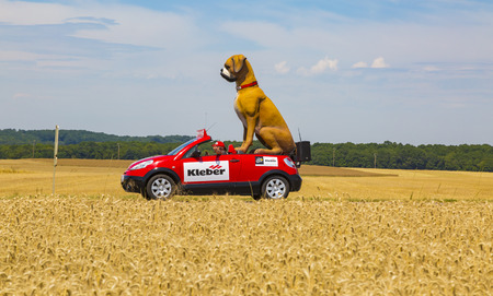 Vendeuvre-sur-Barse, France - 6 July, 2017: The fancy vehicle of Kleber passes through a region of wheat fields in the Publicity Caravan before the cyclists during the stage 6 of Tour de France 2017. Kleber is a famous European company which products a wiのeditorial素材