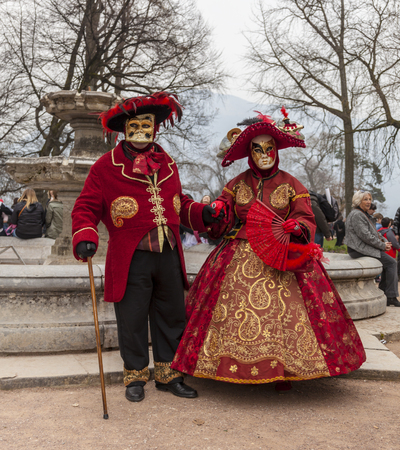 Annecy, France, March 15, 2014:  Portrait of a disguised person, posing in Annecy, France, during a Venetian Carnival which celebrates the beauty of the real Venice.のeditorial素材