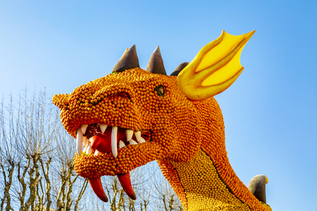 Menton, France - 16.09.2019: Detail of the head of the Dragon made by citrics (lemons and oranges) displayed at the Citrics Motifs Exhibition during the Lemon Festival (Fete du Citron) held in Menton between 16.02-03.03.2019のeditorial素材