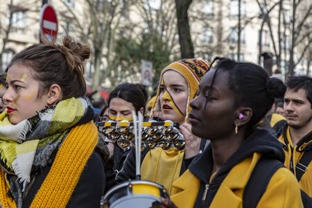 Paris, France - February 11,2018: Portrait of woman musicant perfoming in the street during the...