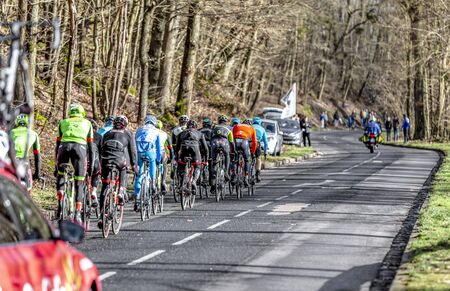 Cote de Senlisse, France - 5 March, 2017: Rear image of the peloton climbing on Cote de Senlisse during the first stage of Paris-nice on 05 March 2017.のeditorial素材