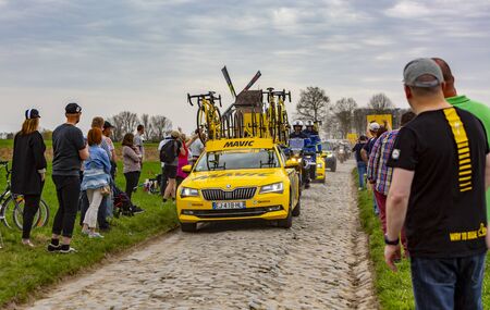 Templeuve, France - April 08, 2018: The technical car of Mavic driving on the cobblestone road in...