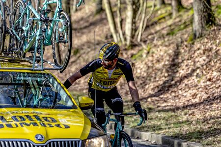 Cote de Senlisse, France - 5 March, 2017: The dutch cyclist Tom Leezer of Team Lotto NL-Jumbo riding near his team car on Cote de Senlisse during the first stage of Paris-nice on 05 March 2017.のeditorial素材