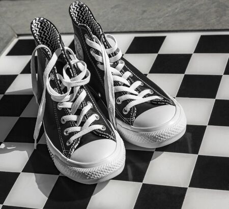 Chartres, France - Spetember 2, 2019: Image of a pair of All Star Converse sneakers on a cobblestone street.のeditorial素材