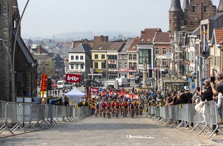Geraardsbergen, Belgium - April 7, 2019 : The feminine peloton   riding on a cobblestone road in Geraardsbergen during Women Tour of Flanders 2019. Marta won this edition of the race.のeditorial素材