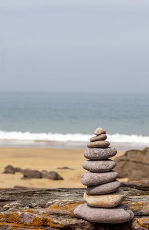 Close-up image of a rocks tower on a rocky beach in Brittany, France.の写真素材