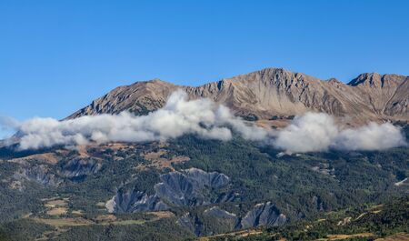 Beautiful landscape with clous and peaks in  The Southern French Alps in Alpes-de-Haute-Provence...