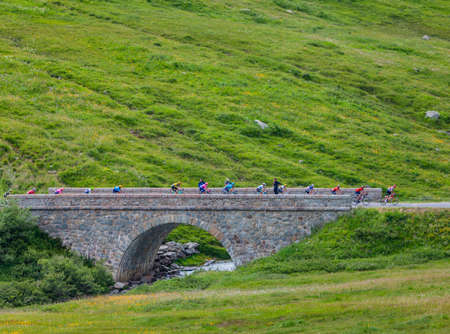 Col de Iseran, France - July 26, 2019: The Peloton climbing the road to Col de Iseran during the stage 19 of Le Tour de France 2019.のeditorial素材