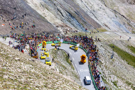 Col du Tourmalet, France - July 20, 2019: The Pubilicity Caravan passing before the cyclists on the road to Col du Tourmalet during the stage 14 of Tour de France 2019.のeditorial素材