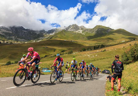 Col de la Madeleine, France - August 24, 2020: Rear view of the peloton climbing the road to Col de...