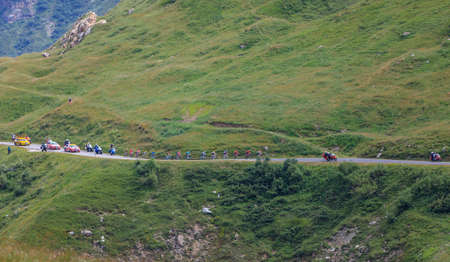 Col de Iseran, France - July 26, 2019: The Peloton climbing the road to Col de Iseran during the stage 19 of Le Tour de France 2019.のeditorial素材