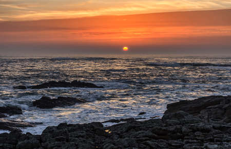Beautiful image of the sunrise over the sea in Brittany in North of France.の写真素材