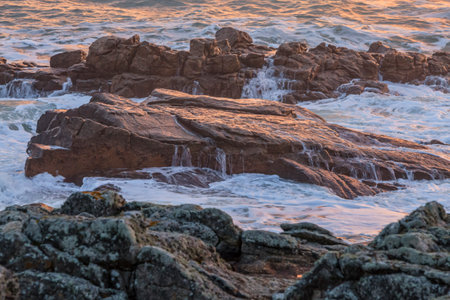 Image of powerful waves at sunset in Brittany in North of France.