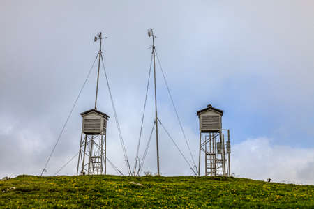 Image of a meteo station at altitude in mountains in a cloudy dayの写真素材