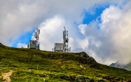 Image of a meteo station at altitude in mountains in a cloudy dayの写真素材
