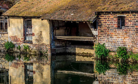 Image of a traditional French laundry on the riverside of the River Ozanne in Brou in Central France.の写真素材