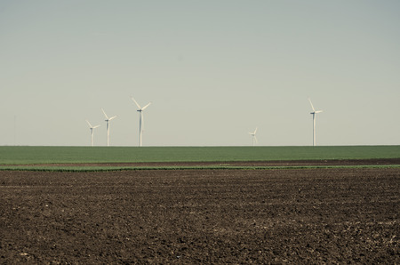 Photo of Spring Rural Landscape: Meadow with Grass and Plowed Land	