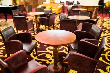 Interior lobby of a hotel with tables and armchairsのeditorial素材