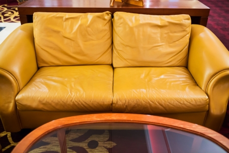 Yellow leather sofa placed in a hotel lobbyの写真素材