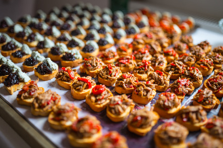 Different types  of delicious canapes placed on the table for ceremonyの写真素材