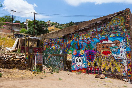 Bisbee, AZ, USA - July 3, 2013: Colored graffiti on a wall in the quirkiest town in America.のeditorial素材