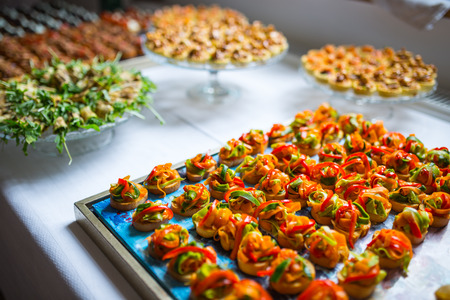 Delicious catering canapes on a buffet tableの写真素材